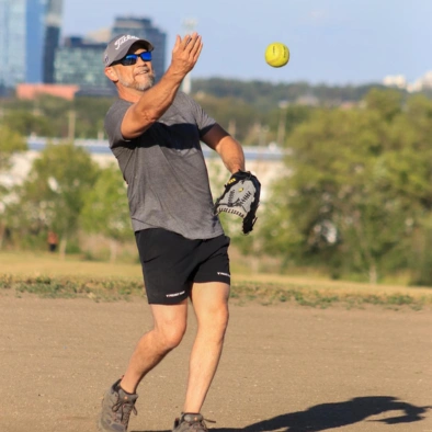 male engineer throwing baseball